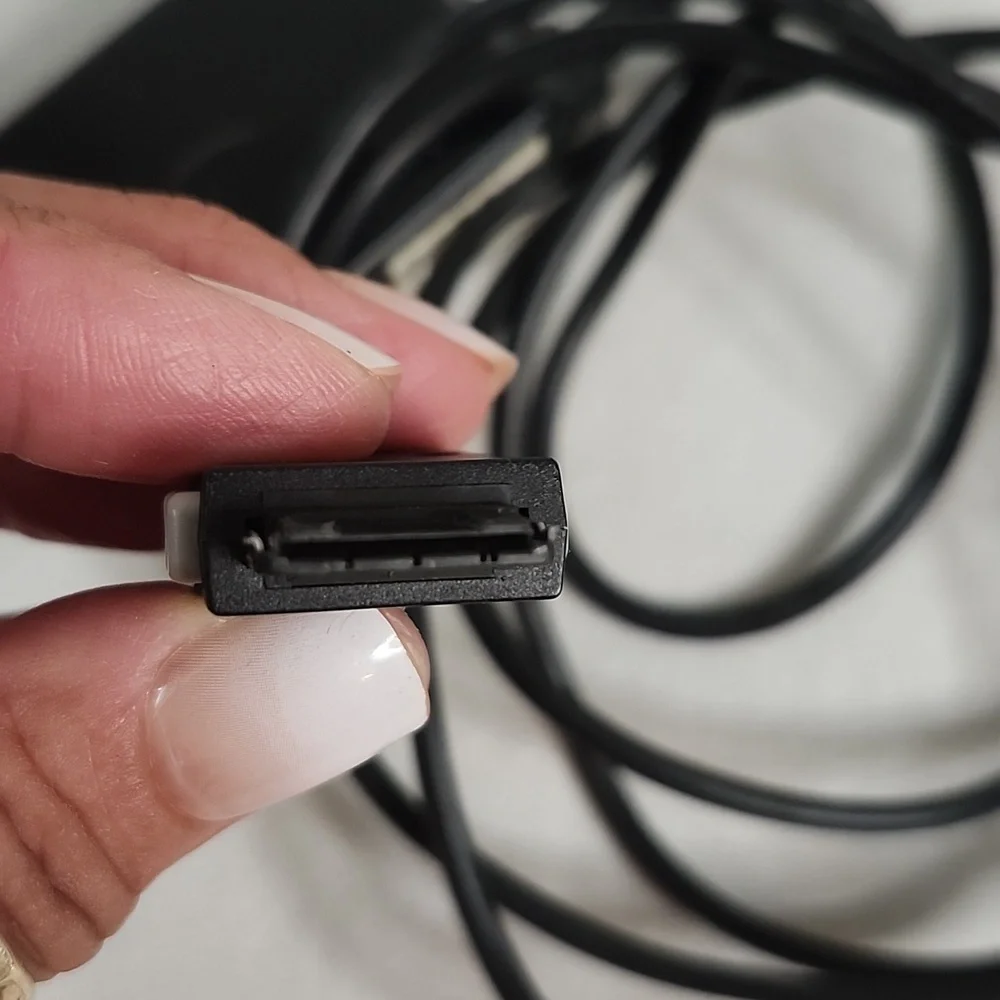 Assorted Vintage Electronic Charging Cables and Cases